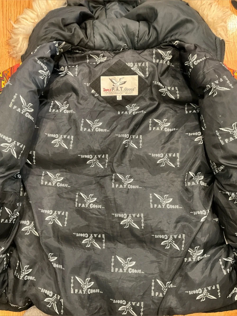 This vintage Triple F.A.T. Goose duck down ski parka features a striking.